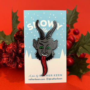 Krampus enamel pin on backing card