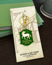Prancing Pony Inn keychain on its illustrated display card