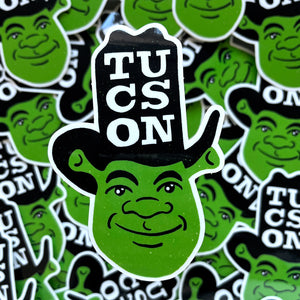 Vinyl sticker of cartoony Shrek character in cowboy hat that says COWBOY