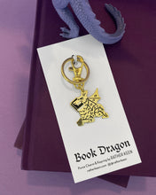 book dragon charm keychain on display card