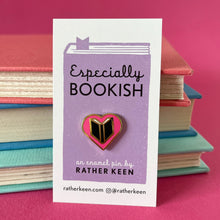The heart-shape Book Lover pin displayed on its backing card
