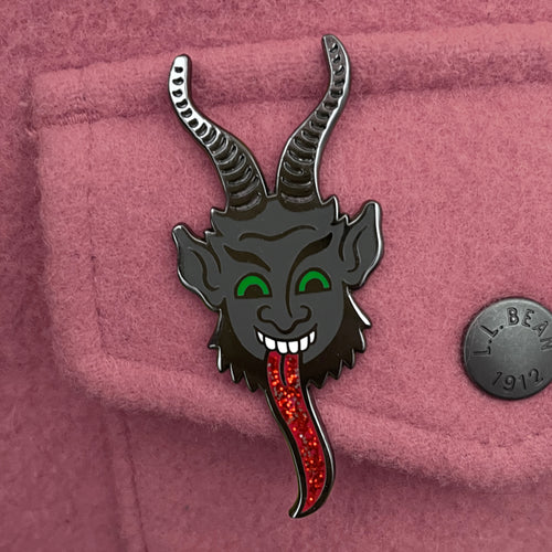 Cartoony Krampus mobster enamel pin