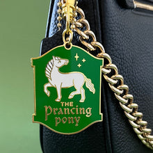 Purse charm that looks like like an old sign for The Prancing Pony inn in Lord of the Rings