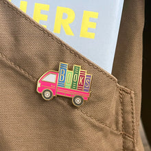 Rather Keen enamel pin book truck on jacket pocket