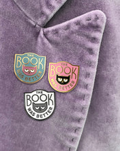 The Rather Keen Book Was Better enamel pin in three colors on a velvet blazer lapel