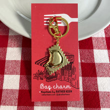 Ravioli bag charm on store display card