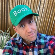 Book baseball hat by Rather Keen. The photo depicts Andrew wearing this green hat