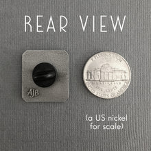 Bad Feeling pin size compared to American nickel coin