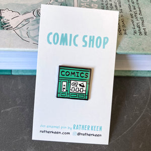 Rather Keen’s comic book shop lapel pin seen on its display card