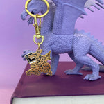 Book Dragon keychain by Rather Ken.