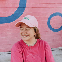Model wearing pink Where is the Bookstore hat