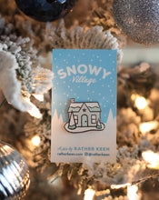 Snowy Glitter House enamel pin by Rather Keen.