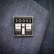 Book Shop enamel pin by Rather Keen. This square shape lapel pin looks like the storefront of a book shop.