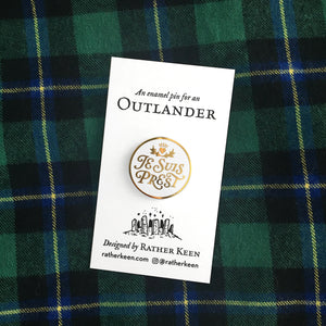 Outlander enamel pin on display card