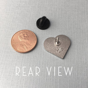 size comparison of Book Lover pin to an American penny