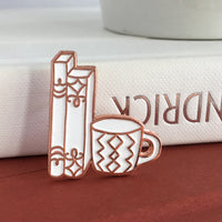 Rose Gold and White Books and Mug enamel pin by Rather Keen
