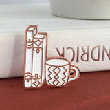 Rose Gold and White Books and Mug enamel pin by Rather Keen