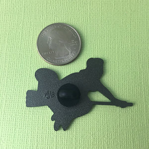 Pinup Witch pin size compared to an American quarter coin